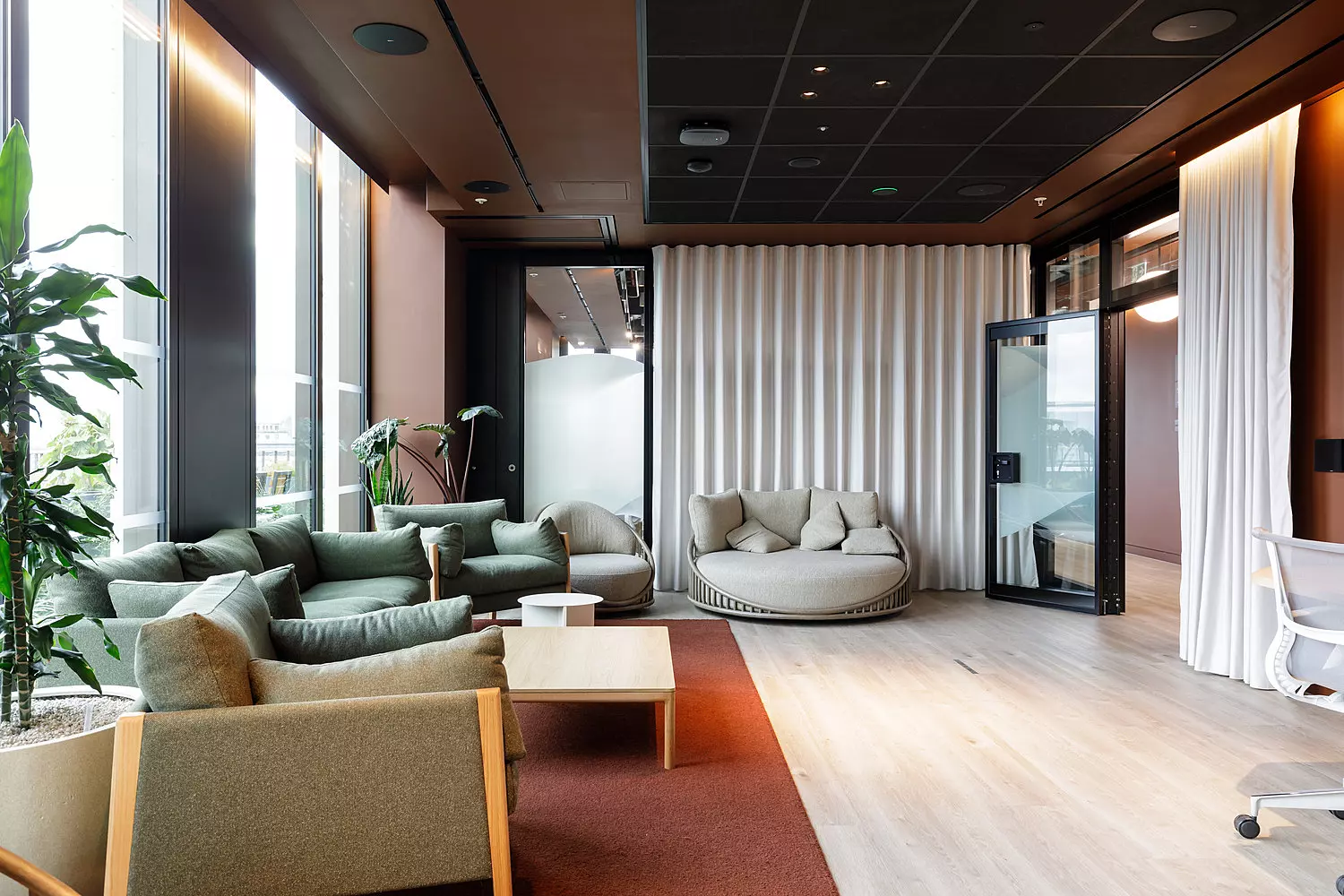 A mix of sofas and comfy chairs