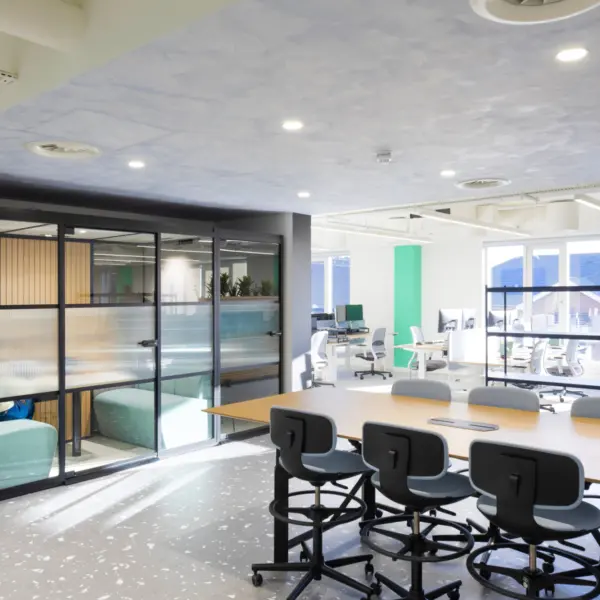 Bausch + Lomb meeting space with a breakout table and soundproofed pods