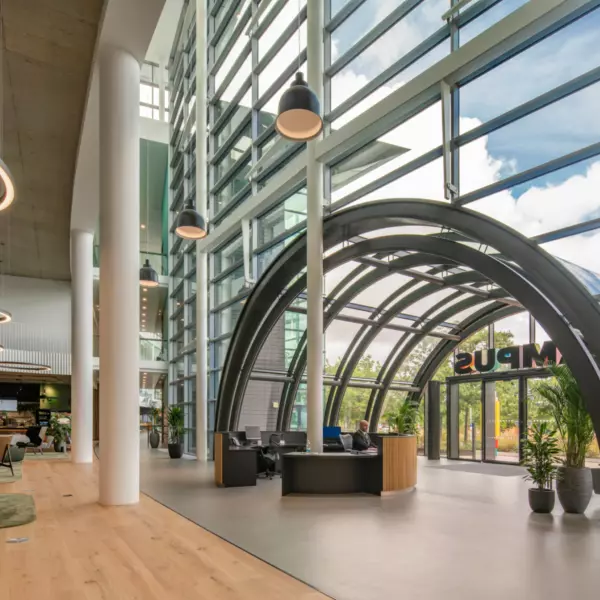 Glazed arches supported by a steel structure make the new entrance foyer
