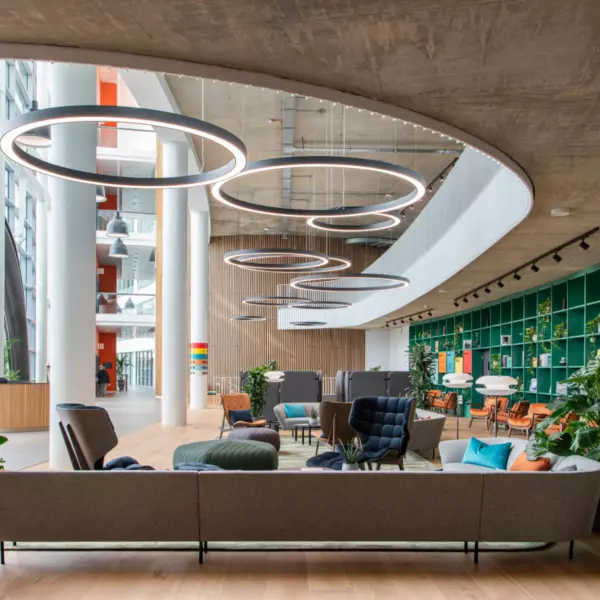 Natural light is complimented but atmospheric LED ring lights in a double height atrium