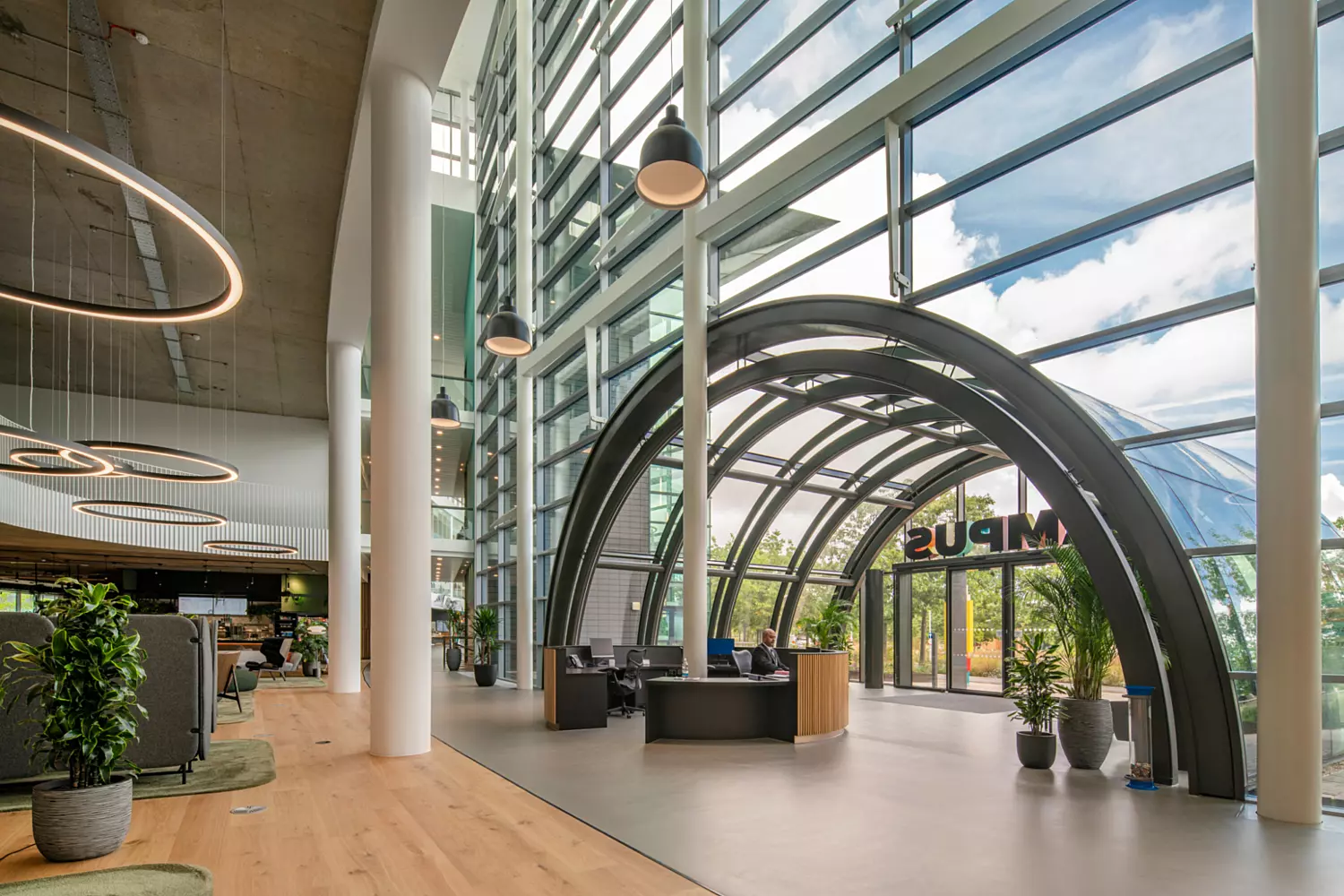 Glazed arches supported by a steel structure make the new entrance foyer