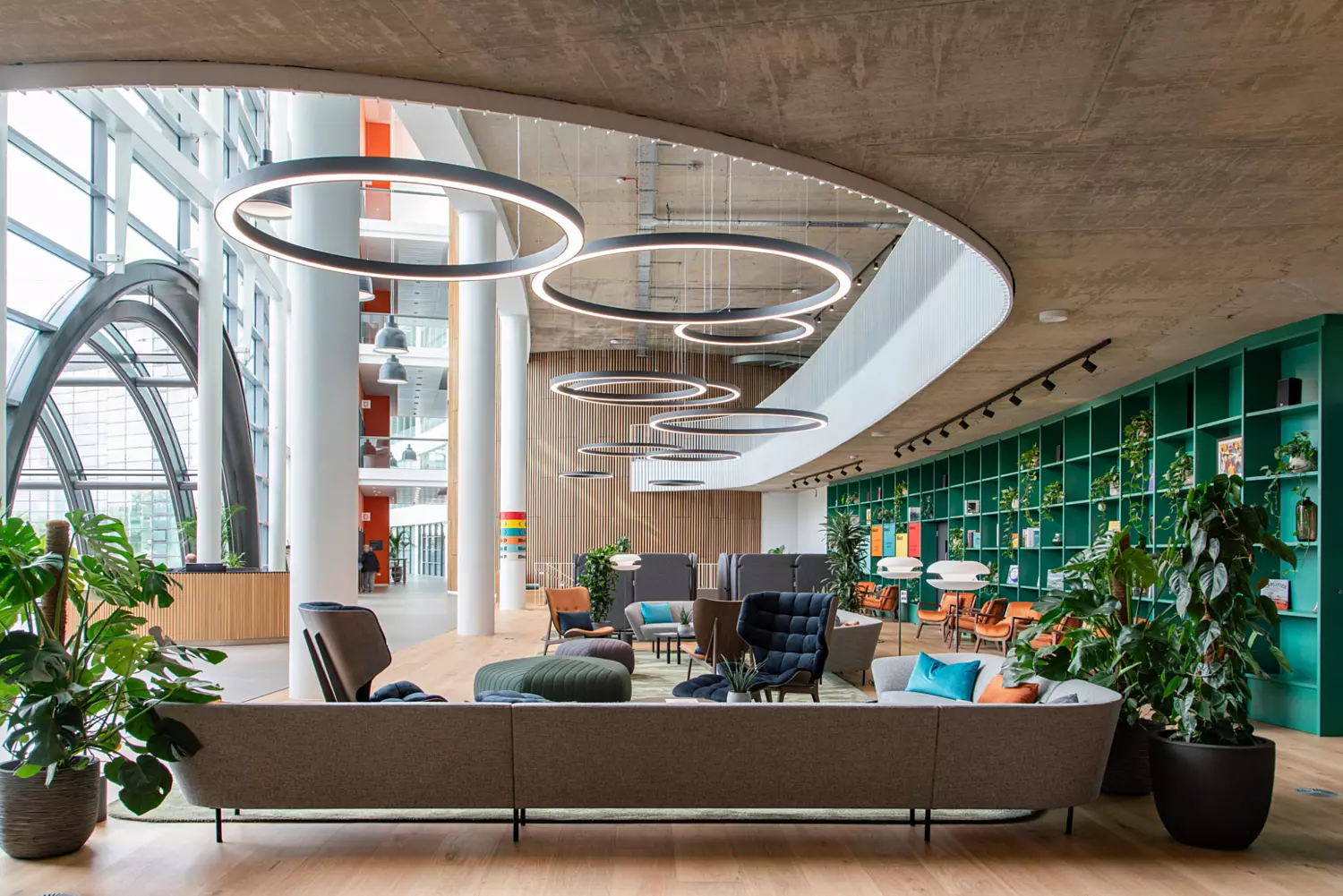 Natural light is complimented but atmospheric LED ring lights in a double height atrium