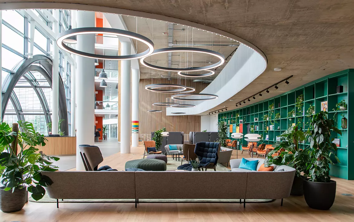 Natural light is complimented but atmospheric LED ring lights in a double height atrium