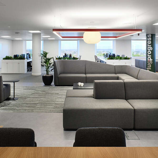 Sofa seating combines with traditional office space