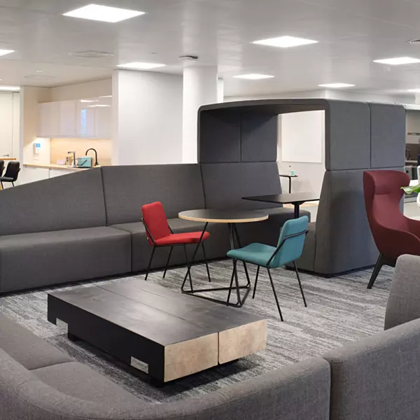 Sofas ottomans high chairs and booths combine with traditional workspace