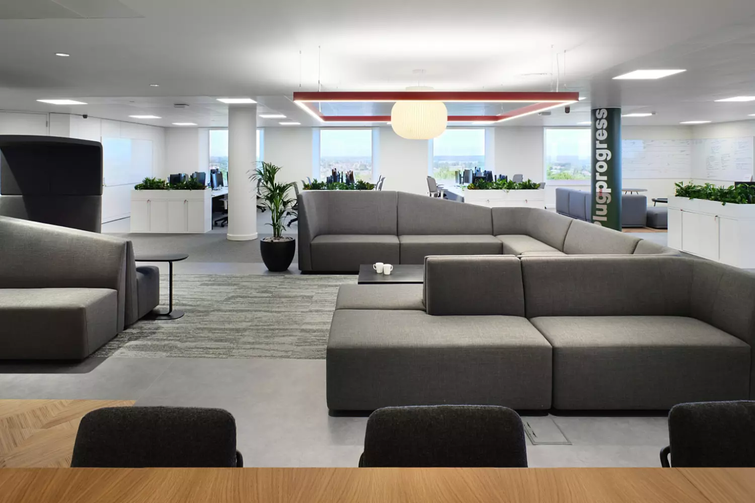 Sofa seating combines with traditional office space