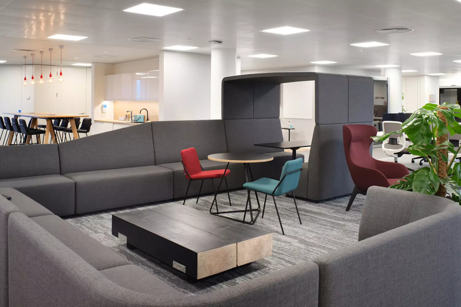 Sofas ottomans high chairs and booths combine with traditional workspace