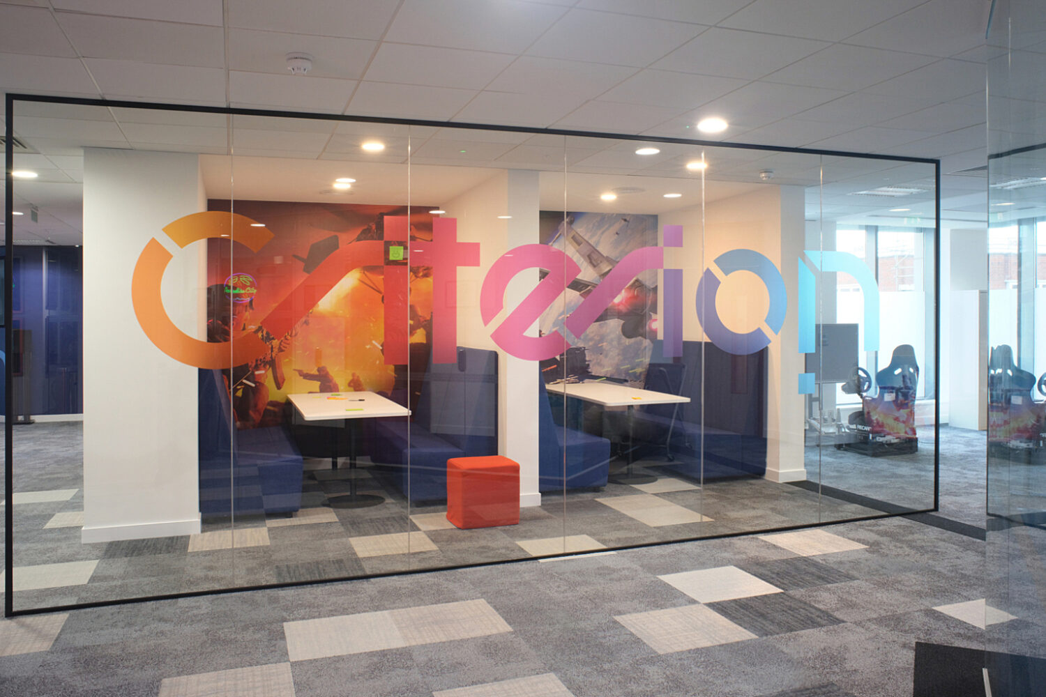 Creative branding expressed on glazed partition in office space