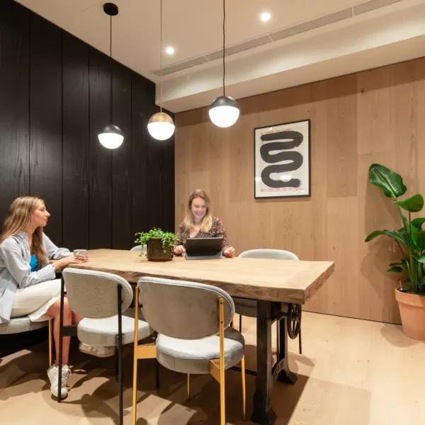 Timber flooring transitions into timber wall panelling