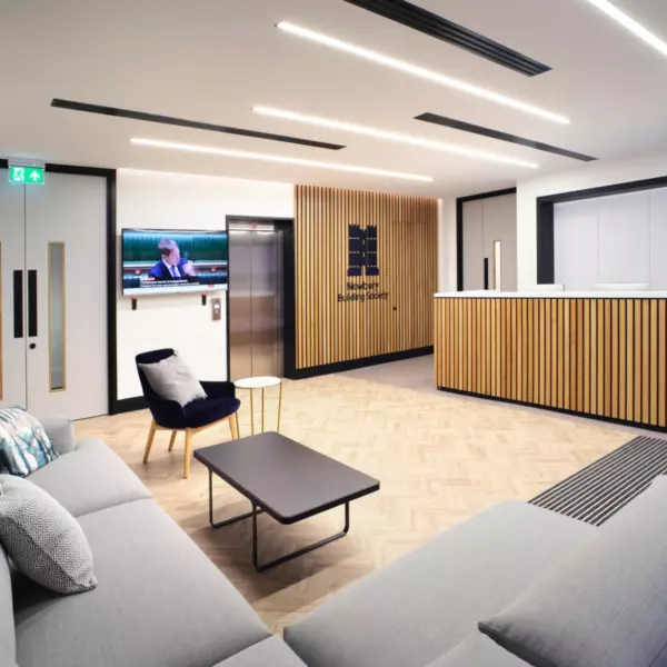 Newbury Building Societies reception features timber beading and soft furnishings