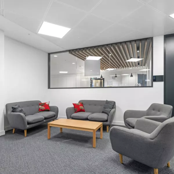 Grey sofas with a large glazed wall