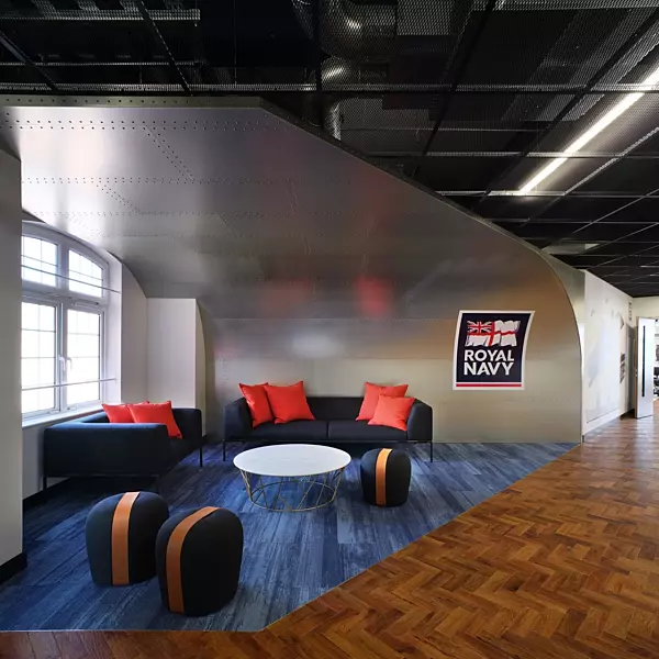 Royal Navy furniture design with blue sofa red pillows