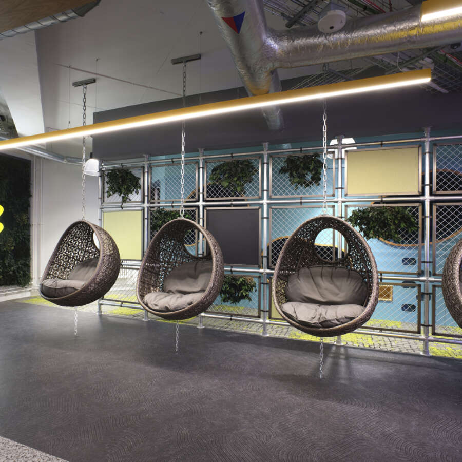 Hanging egg chairs for informal office space