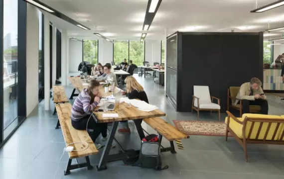 Staff collaborating in balanced workplace