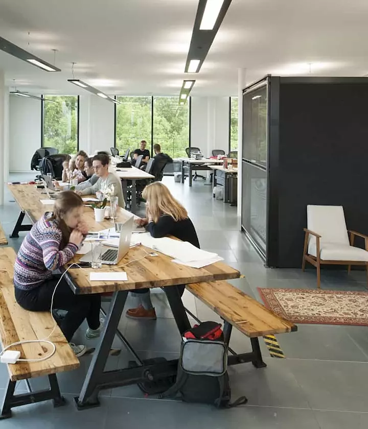 Staff collaborating in balanced workplace