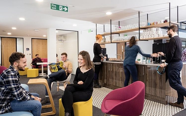 Millennials collaborating in modern office design