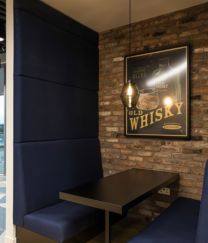 Trendy breakout space with exposed brick design