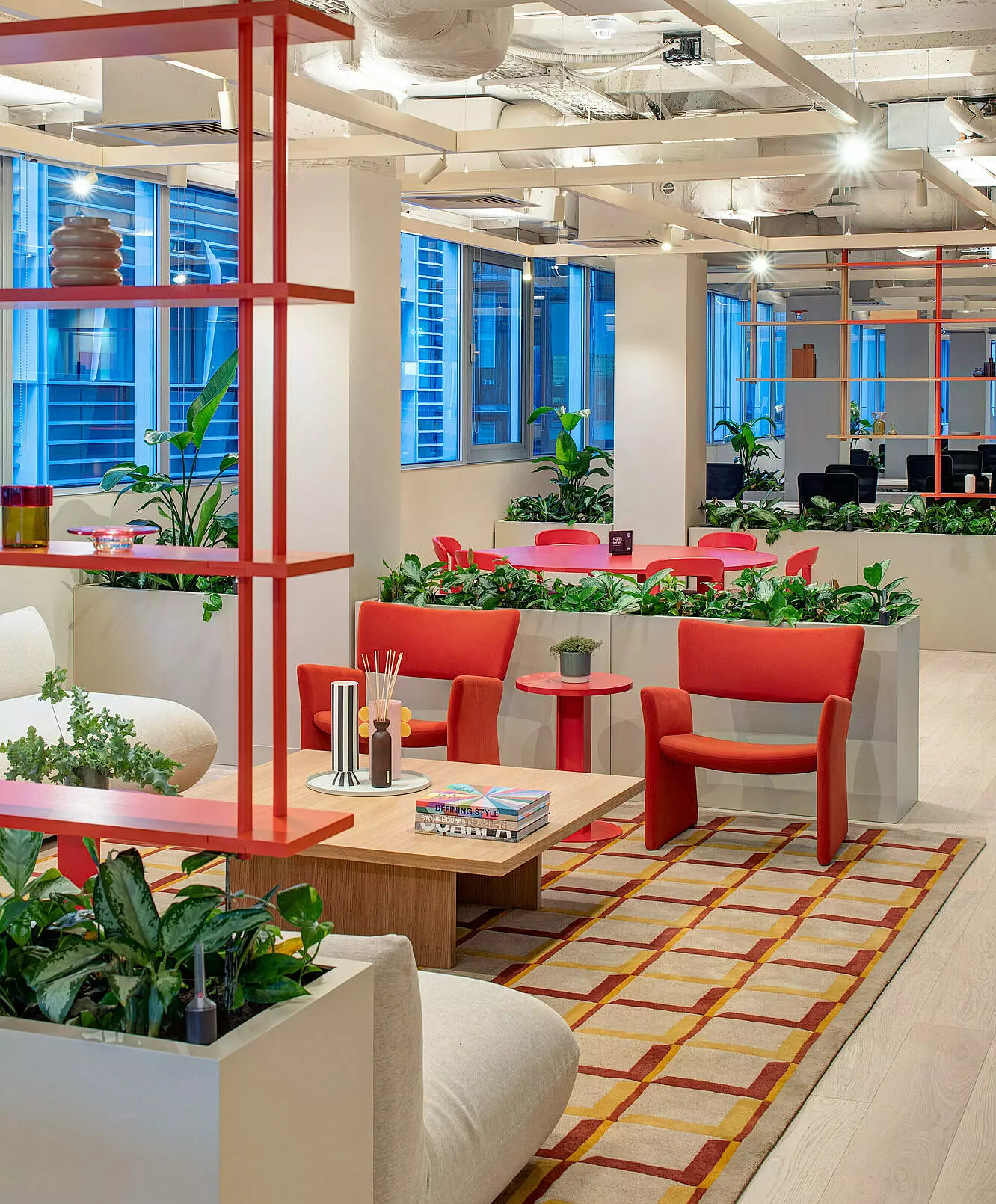 Creative office space with colourful meeting pods and collaborative zones in a refurbished workplace