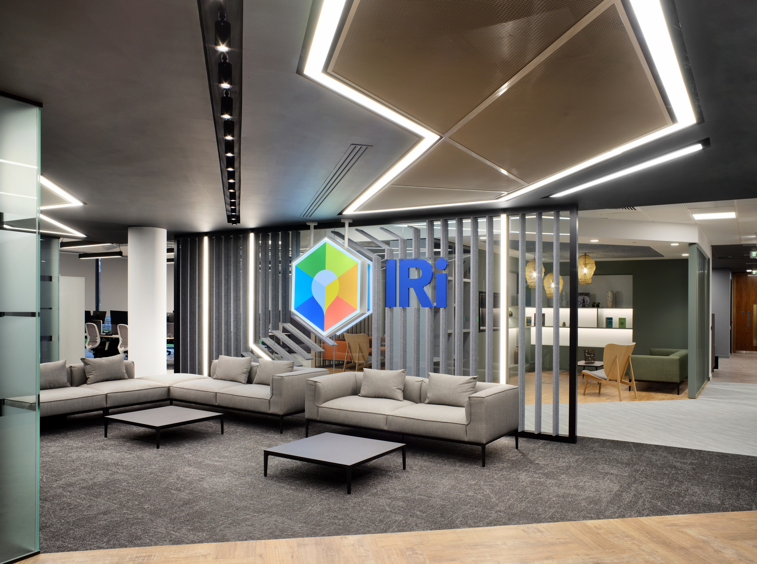 Lit ceiling panels that reflect a company logo