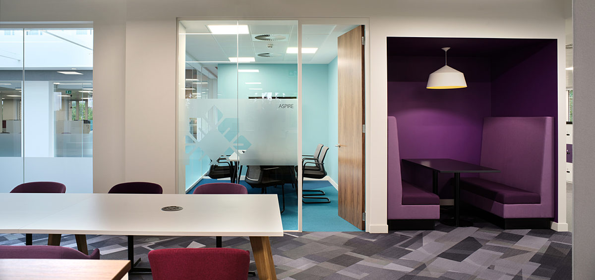 Office with purple booth and modern meeting spaces