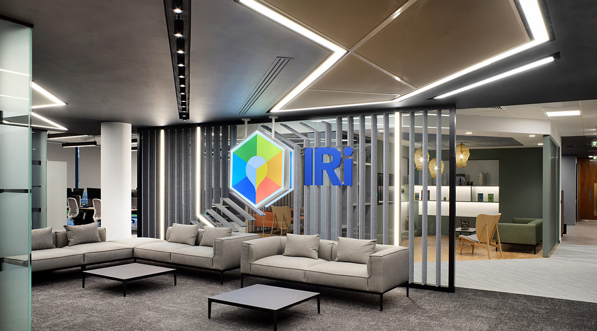 Lit ceiling panels that reflect a company logo