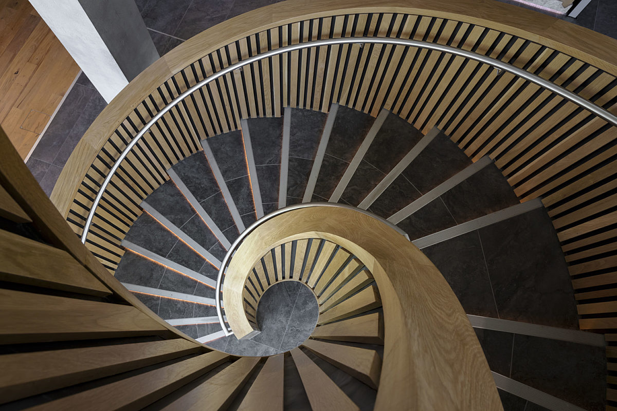 Feature wooden spiral staircase in stylish office