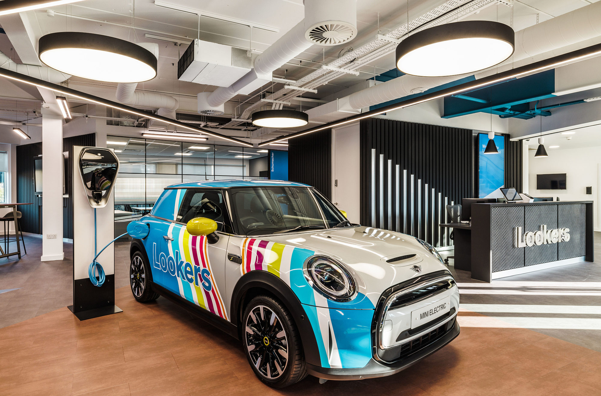 Mini electric car is feature in office fit out