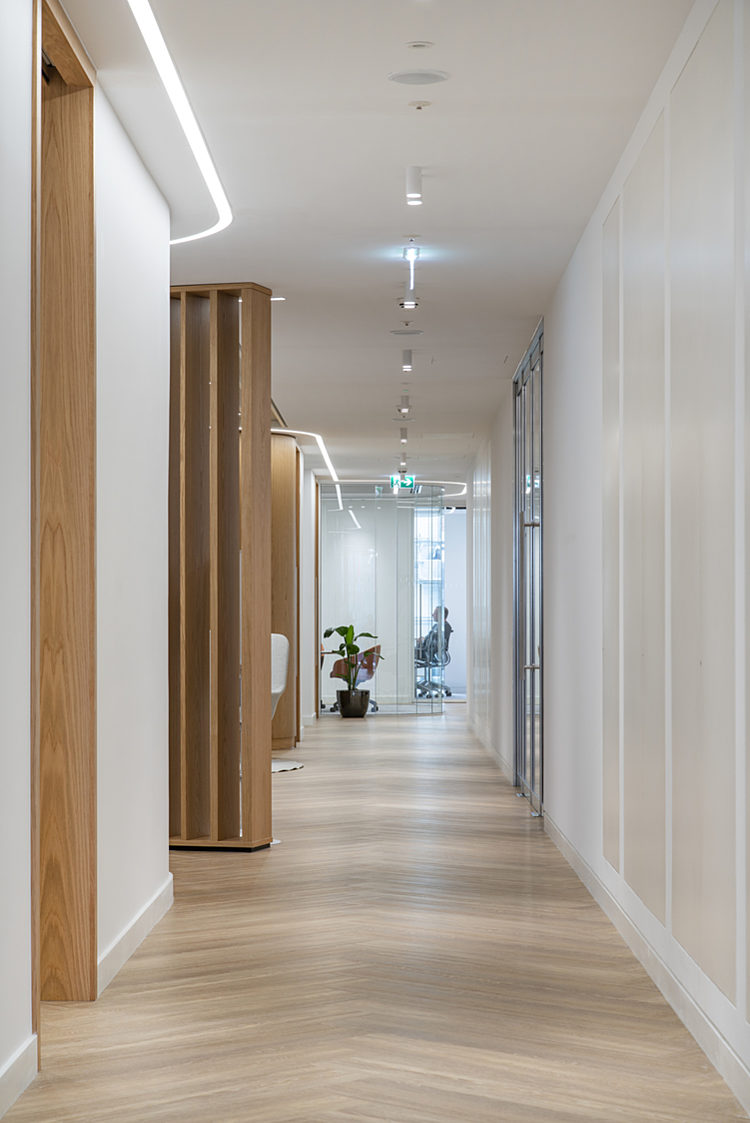 Herringbone floors in modern office corridor