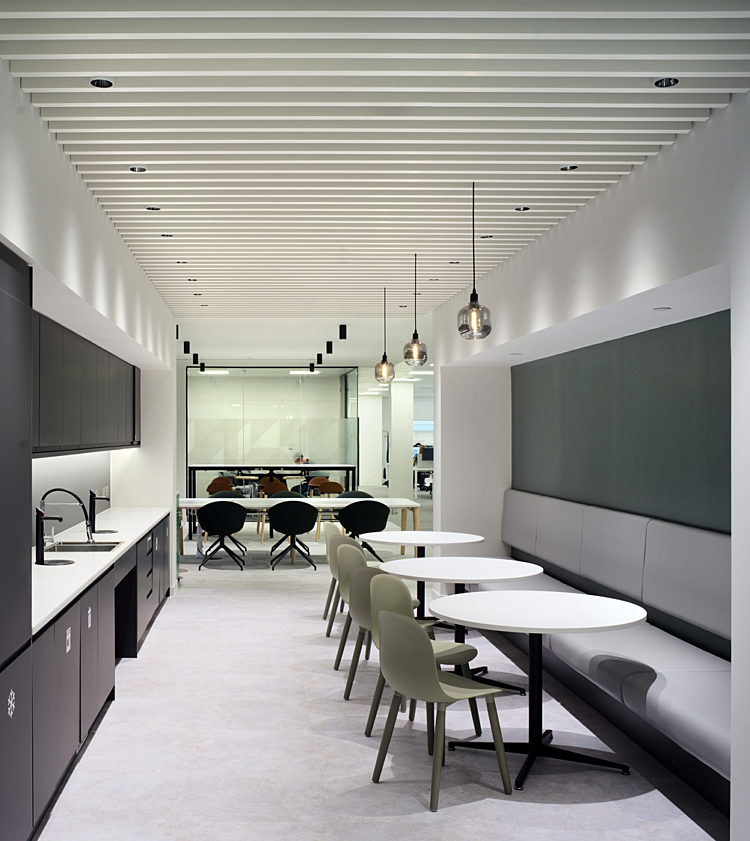 Bench seating with calm colours and an office kitchen