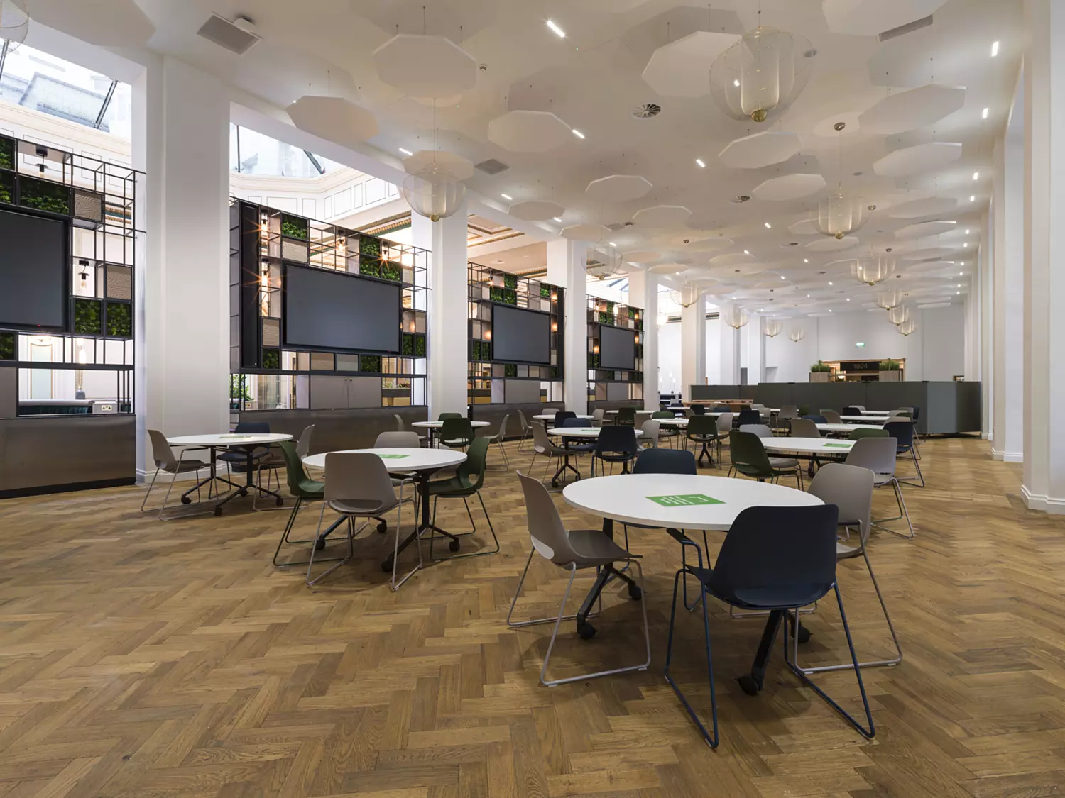 Natural herringbone patterned flooring in office