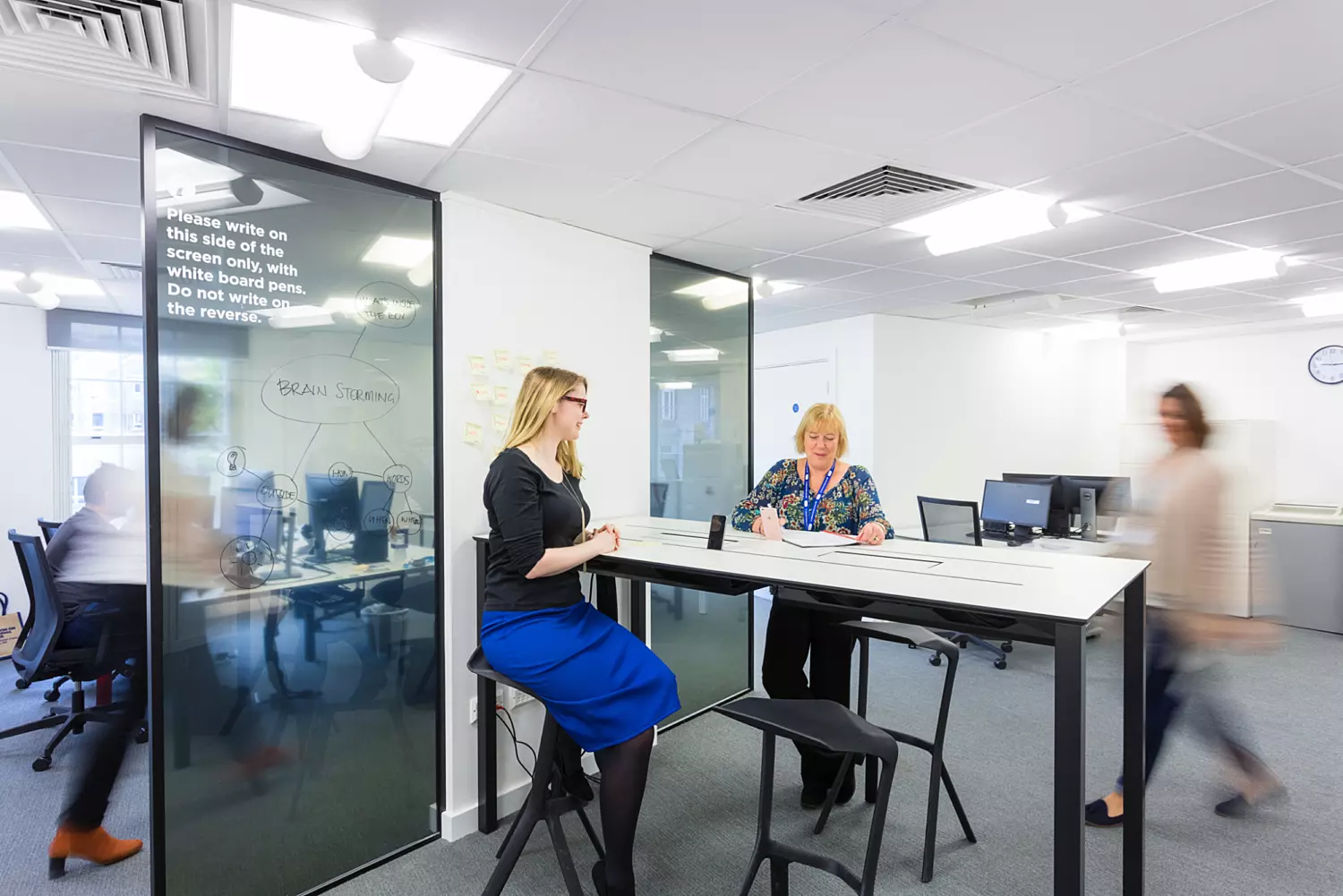 Standing desks and scribble walls in modern office