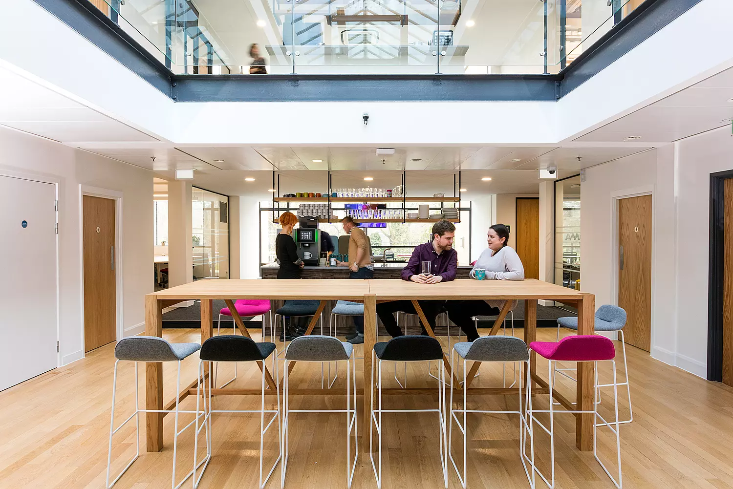 Office design with coffee bar at centre for collaboration
