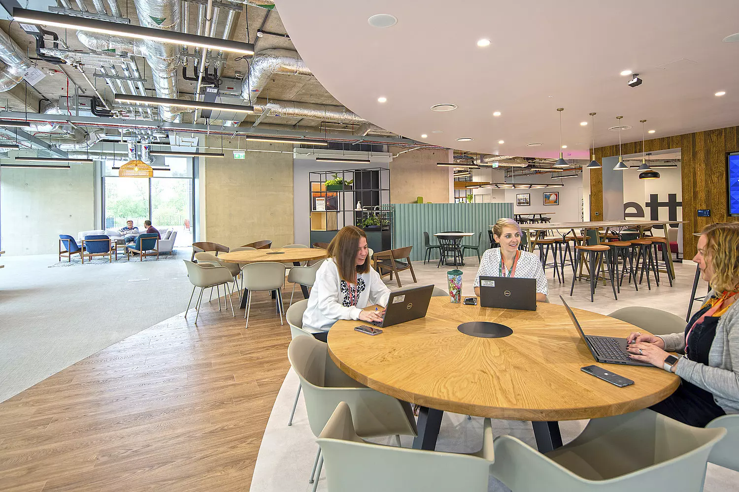 Staff collaborating at Three's Reading HQ