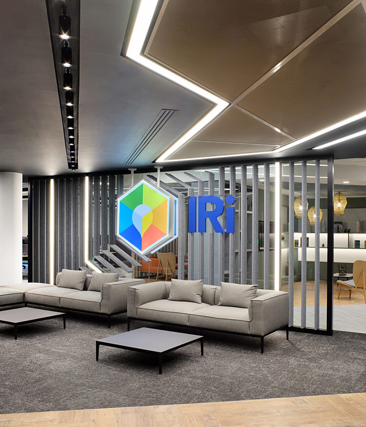 Bright IRI logo with neutral social seating