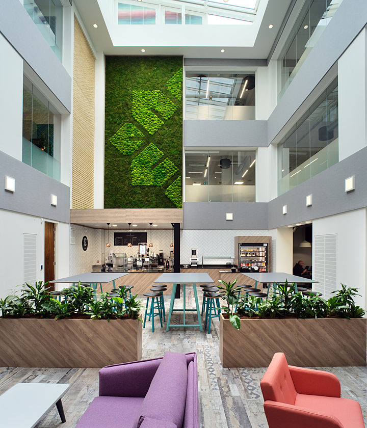 Open atrium with cafe and living wall
