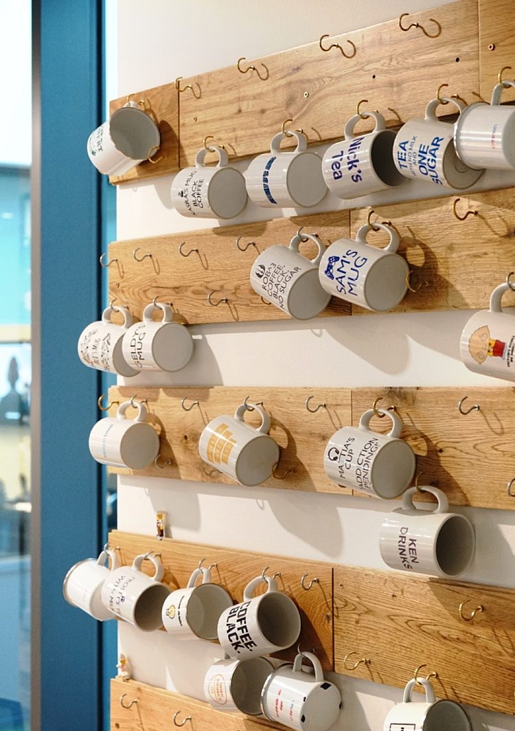 Personalised hanging mug walls in an office