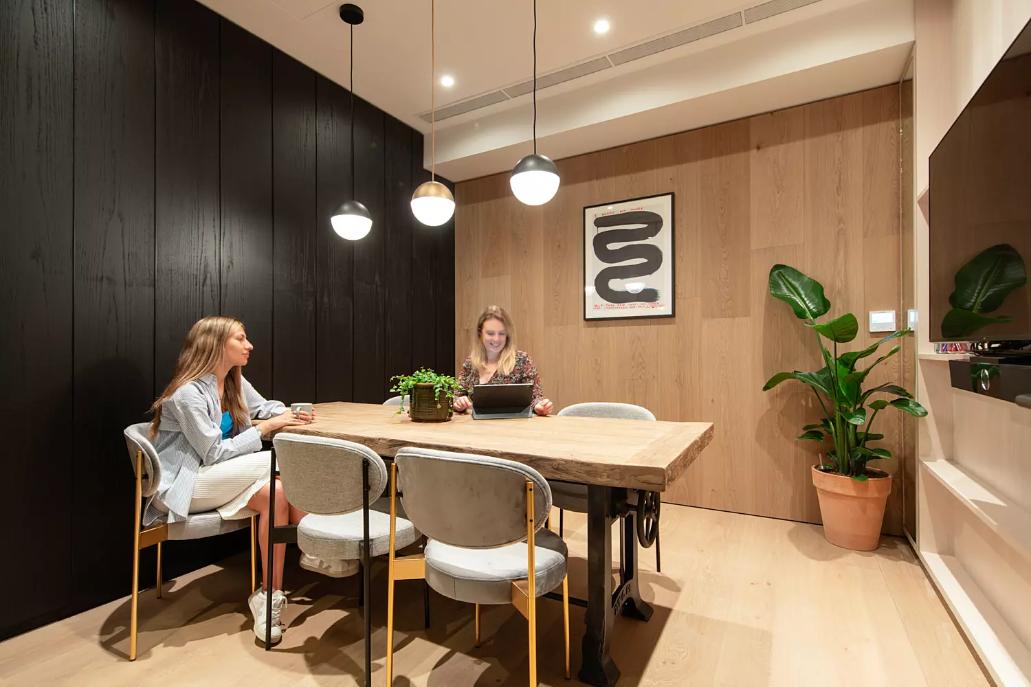 Timber flooring transitions into timber wall panelling