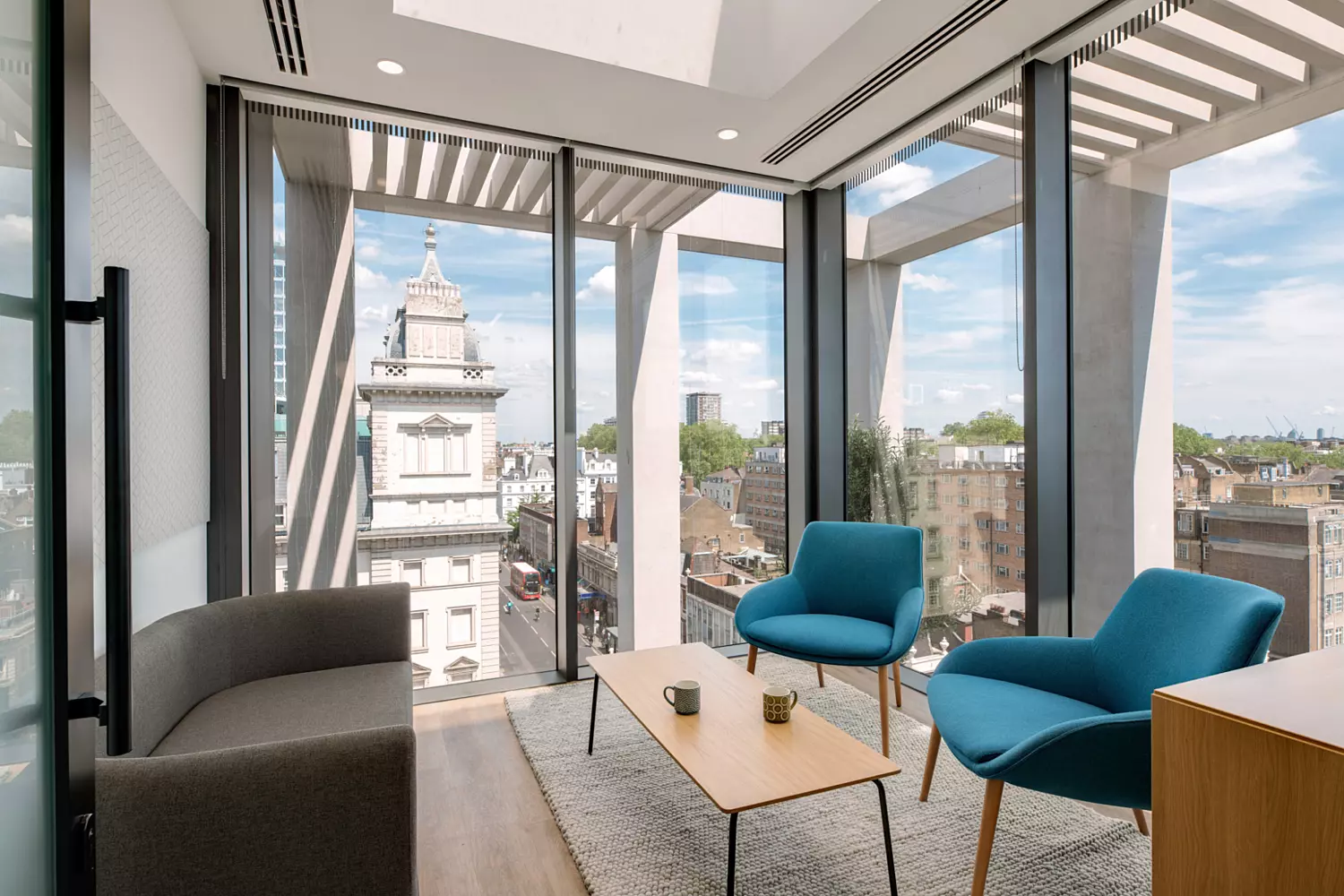 Natural light floods into informal meeting room