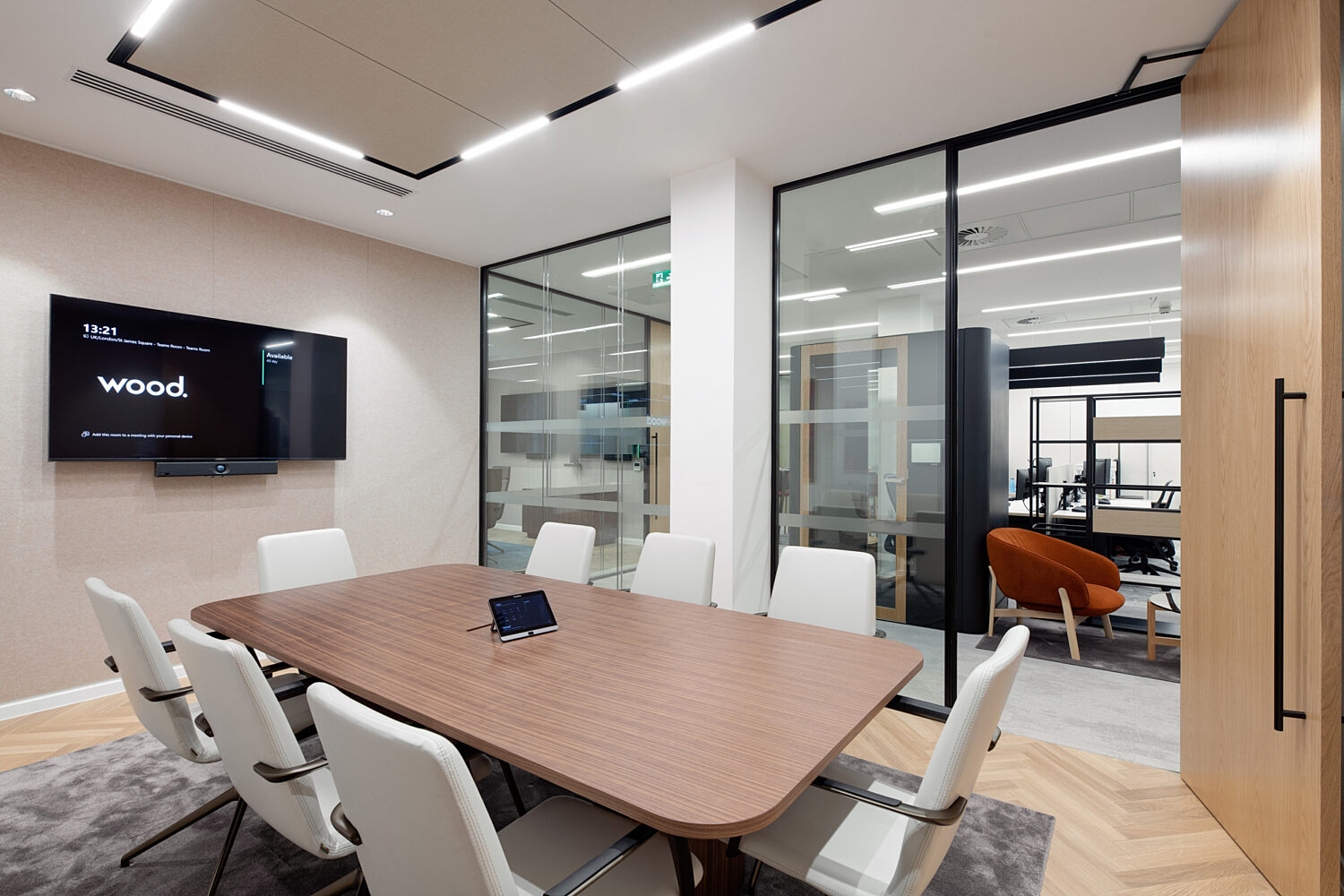 Wood group meeting rooms with private phone booths and office space in the background