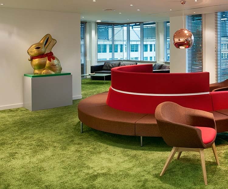 Lindt curvy sofa green carpet office design