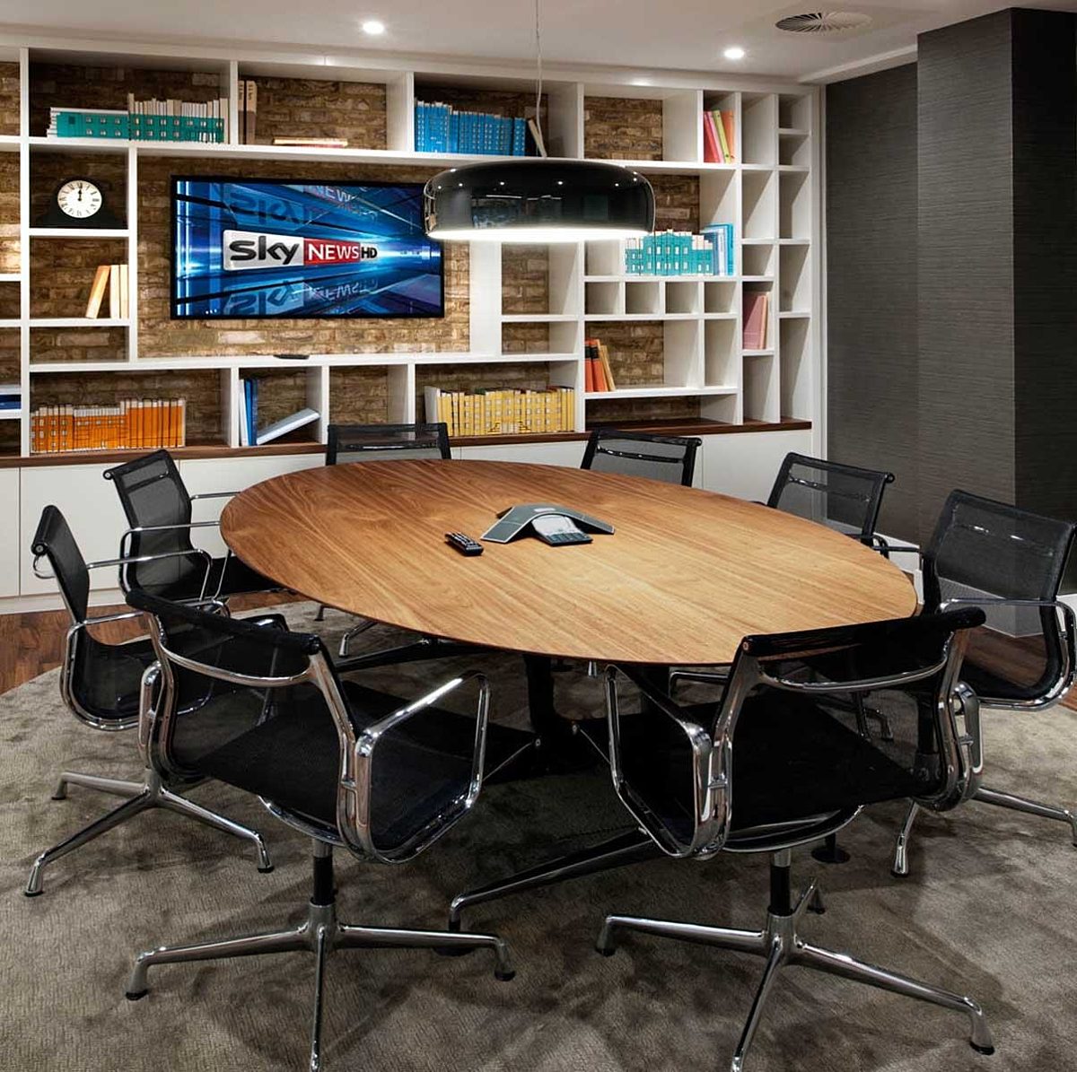 Nuffield boardroom design with bookshelves and tech