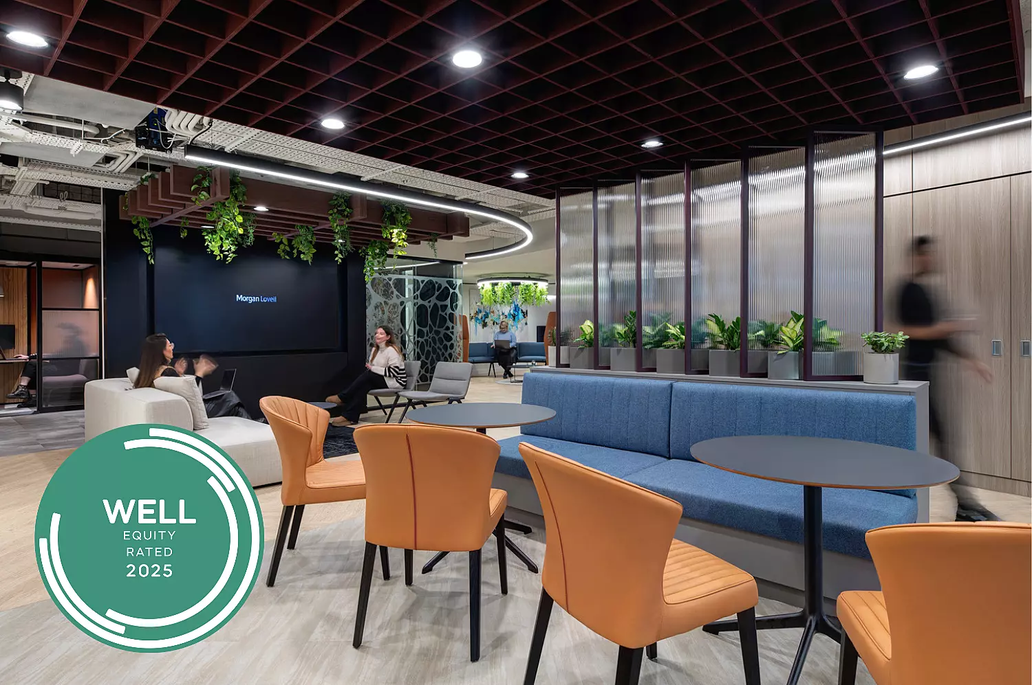 Open plan office area with WELL accreditation logo