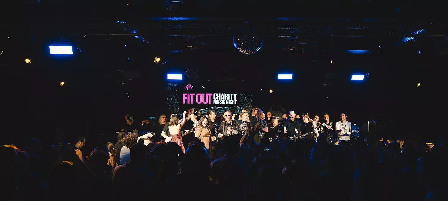 Crowd and stage at music charity night